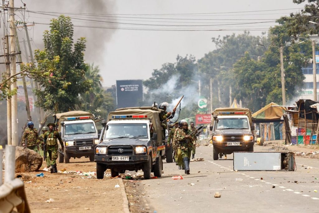 Riot police leave their vehicles during clashes in Nairobi on July 7, 2025. 