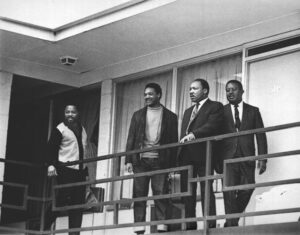 This April 3, 1968, file photo shows Rev. Martin Luther King Jr., second from right, standing with other civil rights leaders on the balcony of the Lorraine Motel in Memphis a day before he was assassinated at approximately the same place. From left are Hosea Williams, Jesse Jackson, King, and Ralph Abernathy.